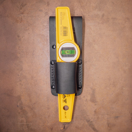 Stabila level holder, shaped level frog on floor.